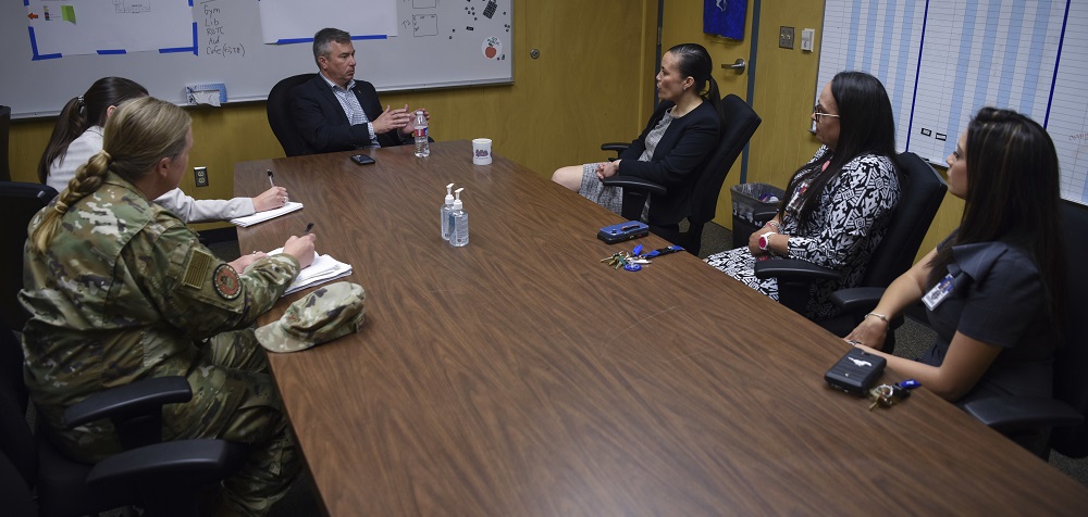 People at a table having a meeting.